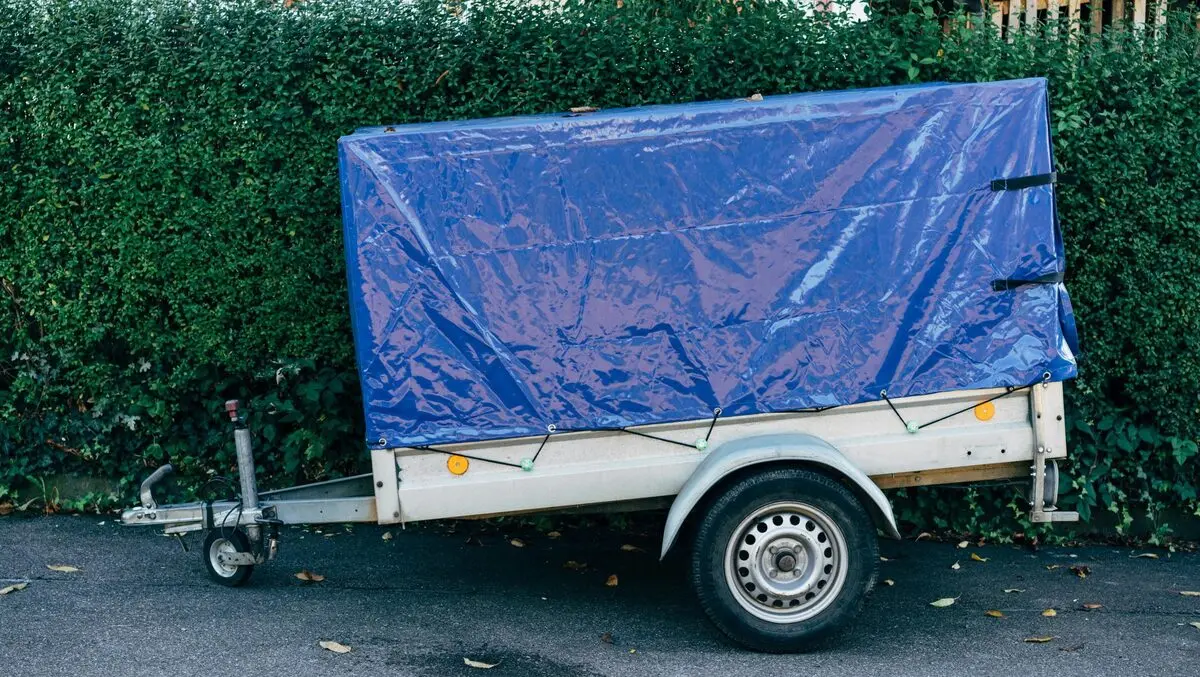 One dead after van struck by unchecked trailer