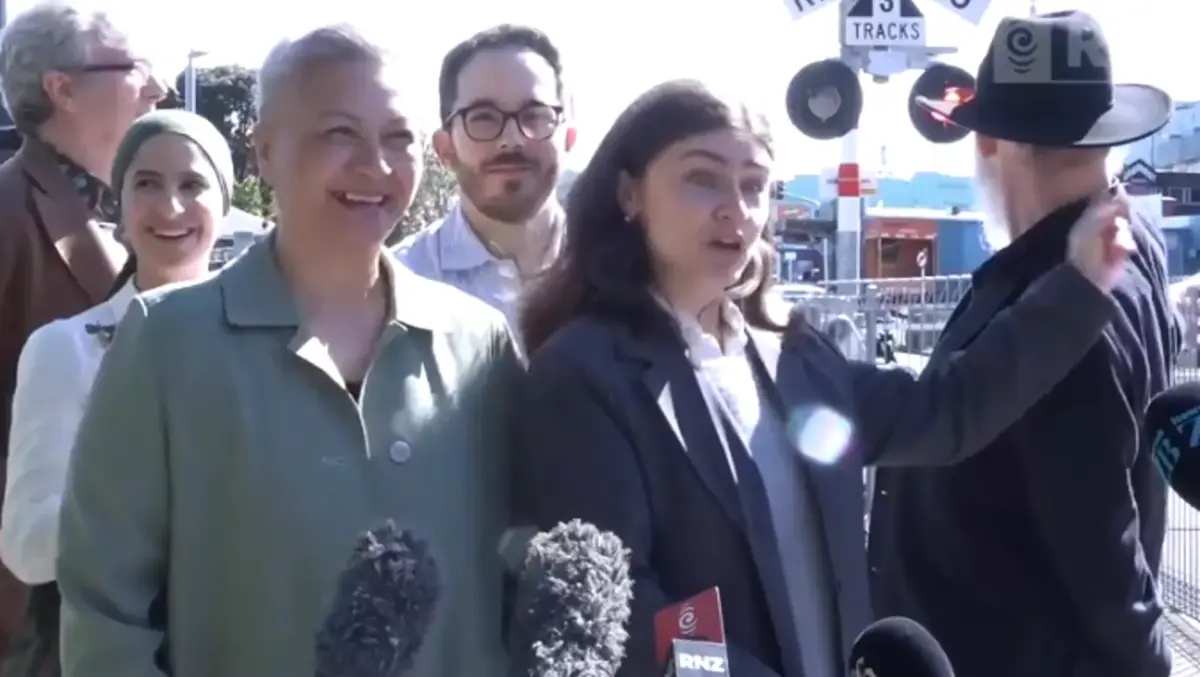 Near miss with train interrupts Greens' level crossing announcement