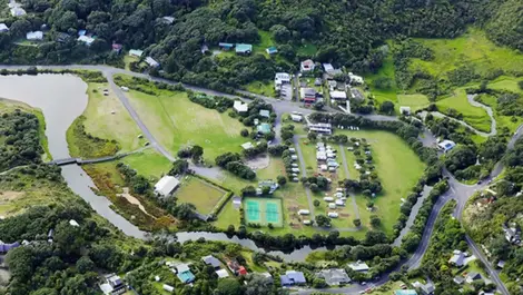 Popular Auckland campground re-opens for summer despite flood risk